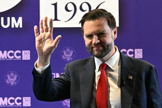 US Vice President JD Vance waves to the audience as he arrives to deliver his remarks at the Mathias Corvinus Collegium in Budapest on April 8, 2026, on the second day of his visit to Hungary. (Photo by Attila KISBENEDEK / AFP)