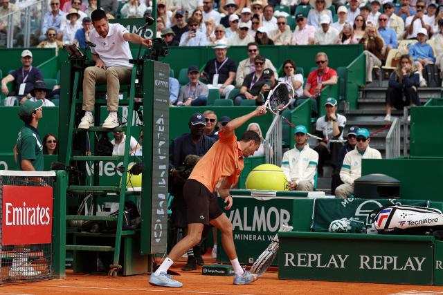 Russia's Daniil Medvedev smashes his racket on the clay as he plays against Italy's Matteo Berrettini during the Monte Carlo ATP Masters Series Tournament round of 32 tennis match on Court Rainier III at the Monte-Carlo Country Club in Roquebrune-Cap-Martin, south-eastern France on April 8, 2026. (Photo by Valery HACHE / AFP)