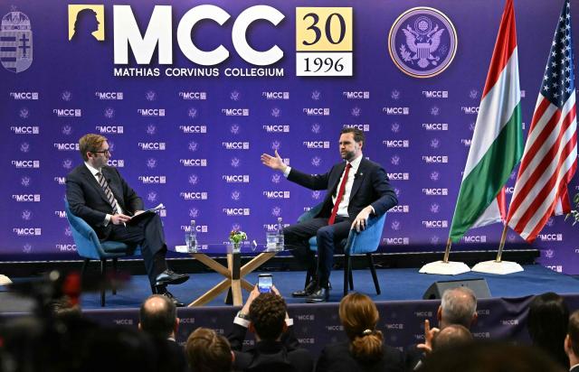 US Vice President JD Vance (R) speaks with the Director General of Mathias Corvinus Collegium (MCC) Zoltan Szalai at the Mathias Corvinus Collegium in Budapest on April 8, 2026, on the second day of Vance's visit to Hungary. (Photo by Attila KISBENEDEK / AFP)