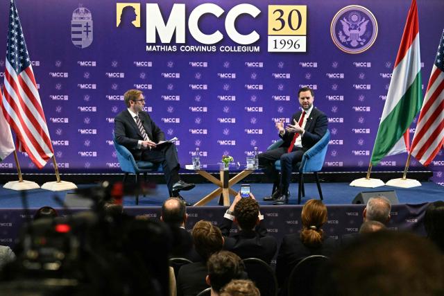 US Vice President JD Vance (R) speaks with the Director General of Mathias Corvinus Collegium (MCC) Zoltan Szalai at the Mathias Corvinus Collegium in Budapest on April 8, 2026, on the second day of Vance's visit to Hungary. (Photo by Attila KISBENEDEK / AFP)