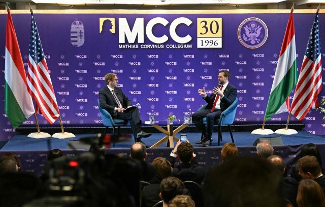 US Vice President JD Vance (R) speaks with the Director General of Mathias Corvinus Collegium (MCC) Zoltan Szalai at the Mathias Corvinus Collegium in Budapest on April 8, 2026, on the second day of Vance's visit to Hungary. (Photo by Attila KISBENEDEK / AFP)