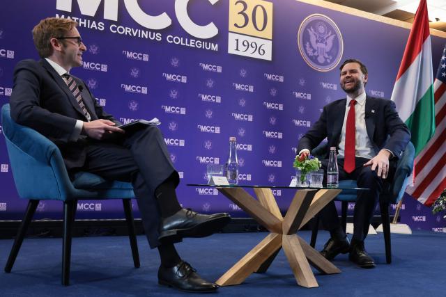 US Vice President JD Vance (R) reacts next to Director General of Mathias Corvinus Collegium, Zoltan Szalai (L), at the Mathias Corvinus Collegium in Budapest on April 8, 2026, on the second day of his visit to Hungary. (Photo by Jonathan Ernst / POOL / AFP)