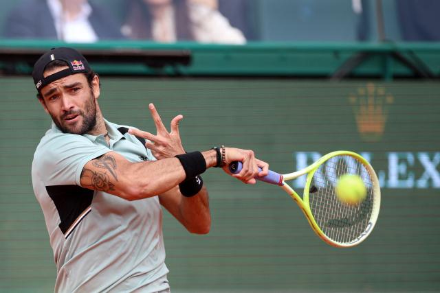 Italy's Matteo Berrettini plays a backhand return to Russia's Daniil Medvedev during the Monte Carlo ATP Masters Series Tournament round of 32 tennis match on Court Rainier III at the Monte-Carlo Country Club in Roquebrune-Cap-Martin, south-eastern France on April 8, 2026. (Photo by Valery HACHE / AFP)