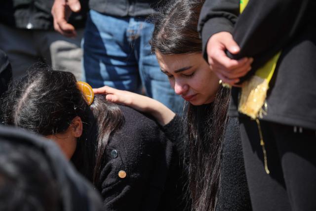 Women mourn during the funeral of a Hezbollah fighter at a temporary graveyard in Choueifat, south of Beirut, on April 8, 2026. Israel's military said on April 8, its forces would continue their campaign against Hezbollah fighters, claiming the ceasefire with Iran does not apply to Lebanon. (Photo by ibrahim AMRO / AFP)