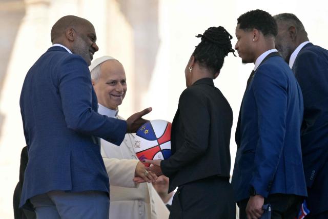 Members of the Harlem Globetrotters meet with Pope Leo XIV at the end of the weekly general audience at St Peter's Square in The Vatican on April 8, 2026. (Photo by Tiziana FABI / AFP)