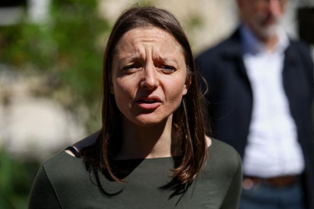 French national Cecile Kohler who was freed by Iran after three and a half years in detention along with compatriot Jacques Paris talks to the press as they are hosted by French President at the Elysee Palace in Paris, on April 8, 2026. The pair had been under house arrest at the French embassy in Tehran ever since being freed from more than three years in prison in November, with their fate even more uncertain after US-Israeli strikes on Iran started on February 28. (Photo by Tom Nicholson / POOL / AFP)