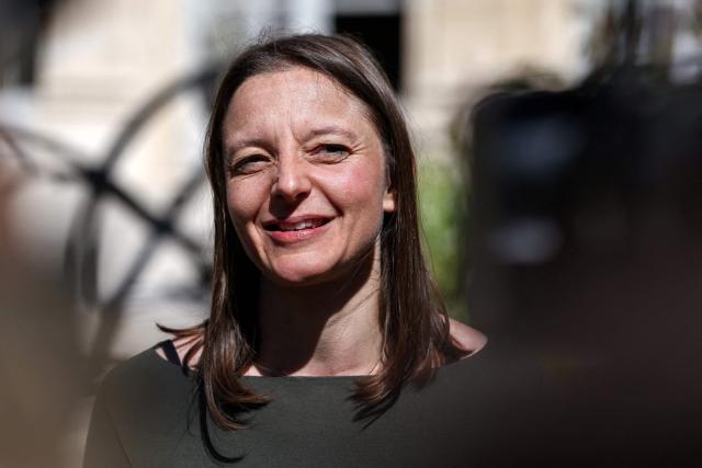 French national Cecile Kohler who was freed by Iran after three and a half years in detention along with compatriot Jacques Paris talks to the press as they are hosted by French President at the Elysee Palace in Paris, on April 8, 2026. The pair had been under house arrest at the French embassy in Tehran ever since being freed from more than three years in prison in November, with their fate even more uncertain after US-Israeli strikes on Iran started on February 28. (Photo by Tom Nicholson / POOL / AFP)
