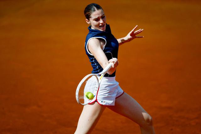 France's Elsa Jacquemot returns the ball to Norway's Malene Helgo during her Billie Jean King Cup play-offs women's singles tennis match in Oeiras, outskirts of Lisbon, on April 8, 2026. (Photo by FILIPE AMORIM / AFP)