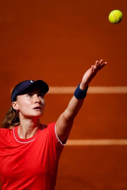 Norway's Malene Helgo serves the ball to France's Elsa Jacquemot during her Billie Jean King Cup play-offs women's singles tennis match in Oeiras, outskirts of Lisbon, on April 8, 2026. (Photo by FILIPE AMORIM / AFP)