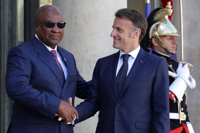 France's President Emmanuel Macron welcomes Ghana’s President John Dramani Mahama (L) for a meeting at The Elysee Presidential Palace in Paris on April 8, 2026. (Photo by Ludovic MARIN / AFP)