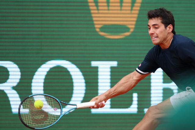 Chile's Cristian Garin plays a forehand return to Germany's Alexander Zverev during the Monte Carlo ATP Masters Series Tournament round of 32 tennis match on Court Rainier III at the Monte-Carlo Country Club in Roquebrune-Cap-Martin, south-eastern France on April 8, 2026. (Photo by Valery HACHE / AFP)