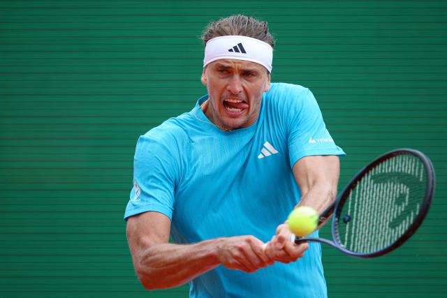 Germany's Alexander Zverev plays a backhand return to Chile's Cristian Garin during the Monte Carlo ATP Masters Series Tournament round of 32 tennis match on Court Rainier III at the Monte-Carlo Country Club in Roquebrune-Cap-Martin, south-eastern France on April 8, 2026. (Photo by Valery HACHE / AFP)