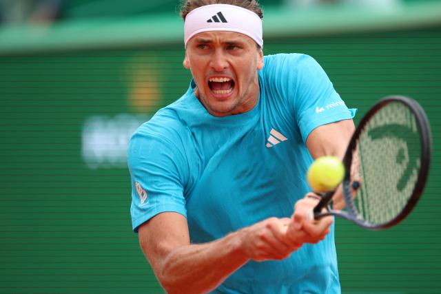 Germany's Alexander Zverev plays a backhand return to Chile's Cristian Garin during the Monte Carlo ATP Masters Series Tournament round of 32 tennis match on Court Rainier III at the Monte-Carlo Country Club in Roquebrune-Cap-Martin, south-eastern France on April 8, 2026. (Photo by Valery HACHE / AFP)