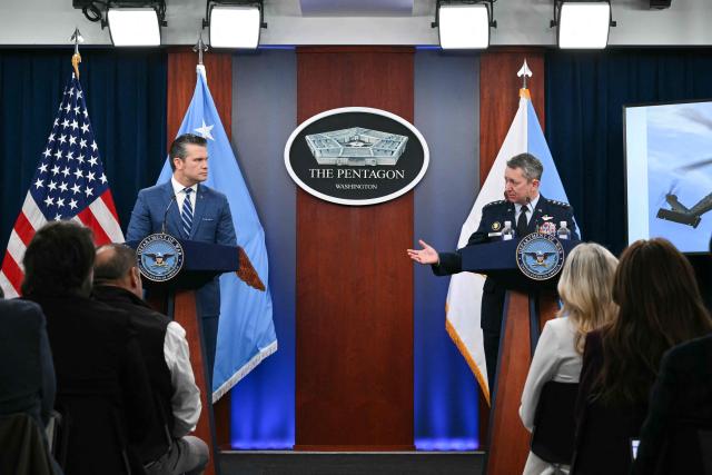 (L/R) US Secretary of Defense Pete Hegseth and Chairman of the Joint Chiefs of Staff Dan Caine speak during a press briefing at the Pentagon in Washington, DC, on April 8, 2026. The United States and Iran agreed to a two-week ceasefire on April 7 barely an hour before President Donald Trump's deadline to obliterate the country, triggering global relief alongside apprehension. Tehran has agreed to temporarily reopen the Strait of Hormuz, through which much of the world's oil, gas and fertiliser passes, easing concerns for the battered global economy. (Photo by Mandel NGAN / AFP)