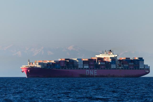 An Ocean Network Express (ONE) container ship sails off the southeastern Mediterranean coast of France with the Corsican mountains in the background in Marseille on April 7, 2026. (Photo by Thibaud MORITZ / AFP)