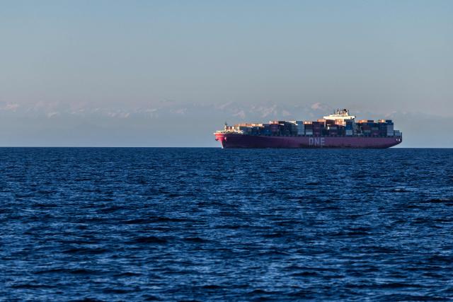 An Ocean Network Express (ONE) container ship sails off the southeastern Mediterranean coast of France with the Corsican mountains in the background in Marseille on April 7, 2026. (Photo by Thibaud MORITZ / AFP)