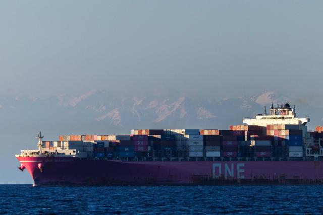 An Ocean Network Express (ONE) container ship sails off the southeastern Mediterranean coast of France with the Corsican mountains in the background in Marseille on April 7, 2026. (Photo by Thibaud MORITZ / AFP)