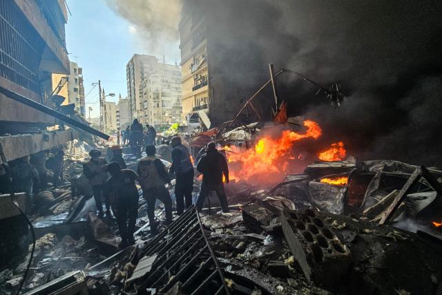 First responders stand amid rubble at the site of an Israeli airstrike in Beirut's Corniche al-Mazraa neighbourhood on April 8, 2026. Israel launched a series of strikes in Beirut on April 8, causing panic among residents in the most violent attack on the capital since the start of the war with Hezbollah. The Israeli military said it carried out its "largest coordinated strike across Lebanon". Israel has insisted the two-week truce in its war with Iran does not apply to Lebanon. (Photo by AFP)
