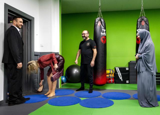 Queen Maxima of the Netherlands takes off her shoes during a visit of the  community center De Bol in Amsterdam on April 8, 2026. (Photo by Remko de Waal / ANP / AFP) / Netherlands OUT
