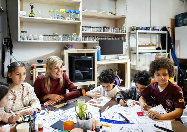 Queen Maxima of the Netherlands speaks with children who are drawing during a visit of the community center De Bol in Amsterdam on April 8, 2026. (Photo by Remko de Waal / ANP / AFP) / Netherlands OUT