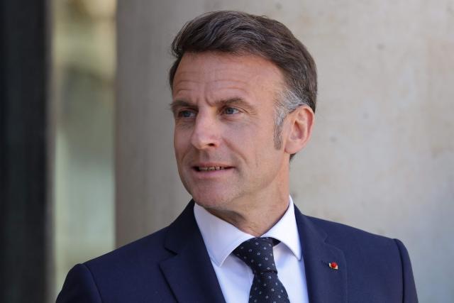 France's President Emmanuel Macron looks on as he waits to welcome Ghana’s President for a meeting at The Elysee Presidential Palace in Paris on April 8, 2026. (Photo by Ludovic MARIN / AFP)