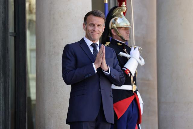 France's President Emmanuel Macron gestures as he waits to welcome Ghana’s President for a meeting at The Elysee Presidential Palace in Paris on April 8, 2026. (Photo by Ludovic MARIN / AFP)