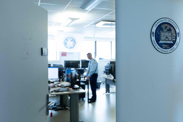 This photograph shows an investigator at the offices of the National Cyber Unit (Unite Nationale Cyber, UNCyber) of the National Gendarmerie based in Pontoise on April 7, 2026. (Photo by Joel Saget / AFP)