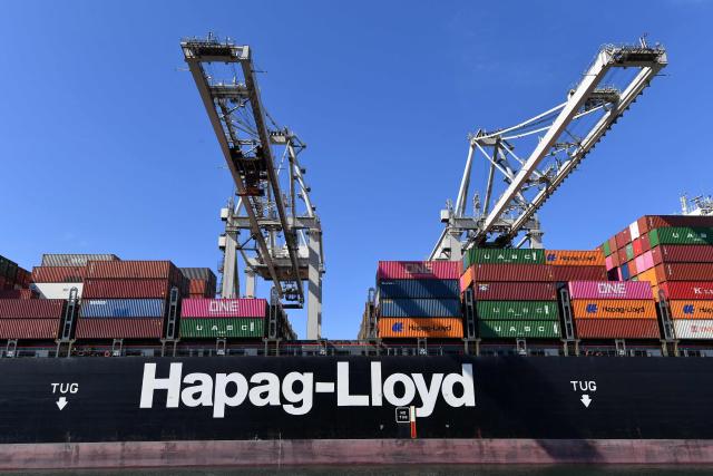 (FILES) A Hapag Lloyd container ship is seen in Rotterdam's harbour on August 1, 2022. German shipping giant Hapag-Lloyd's vessels will not resume transiting the Strait of Hormuz for now as the situation remains "tense" despite a ceasefire between the United States and Iran, German media reported on April 8, 2026. (Photo by JOHN THYS / AFP)