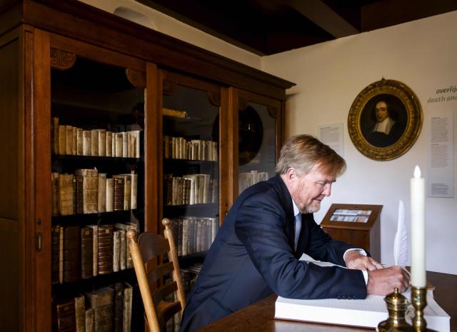 King Willem-Alexander signs the guestbook during the opening of the renovated museum Het Spinozahuis that showcases the life and ideas of philosopher Baruch Spinoza, in Rijnsburg on April 8, 2026. (Photo by Sem van der Wal / ANP / AFP) / Netherlands OUT