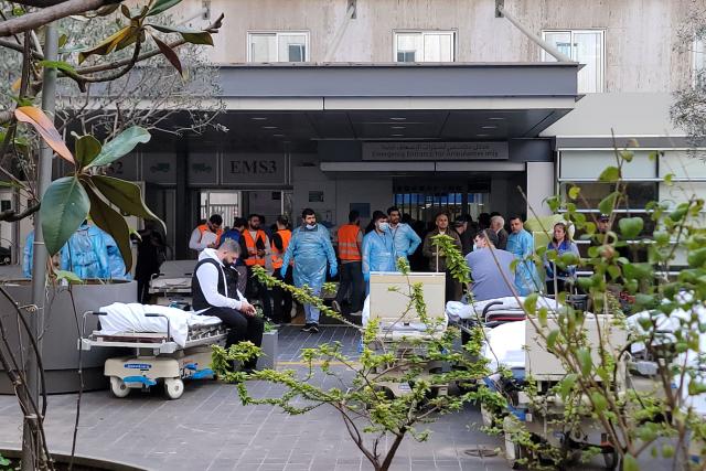 Paramedics wait for the arrival of victims being rushed to a hospital in Beirut following a series of Israeli airstrikes that targeted several areas in the Lebanese capital and its outskirts on April 8, 2026. Israel launched a series of strikes in Beirut, causing panic among residents in the most violent attack on the capital since the start of the war with Hezbollah. Israel also hit Beirut's southern suburbs and southern Lebanon, where Hezbollah holds sway, in parallel with strikes on the east. Israel has insisted the two-week truce in its war with Iran does not apply to Lebanon. (Photo by Fadel ITANI / AFP)