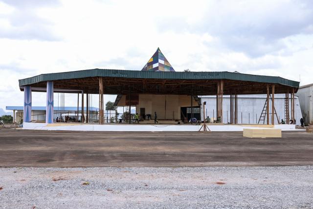 A general view of the wooden church currently under construction at 101 Air Base, where Pope Leo XIV’s final Mass during his visit will be celebrated, in Yaounde on April 8, 2026. (Photo by Daniel BELOUMOU OLOMO / AFP)