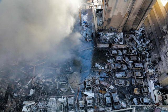 Firefighters attempt to extinguish a fire following an Israeli strike at the Corniche al-Mazraa neighbourhood of Beirut on April 8, 2026. Around 2:00 pm (1100 GMT), a series of Israeli strikes slammed into the Lebanese capital without warning, triggering scenes of panic. Israeli strikes on Lebanon on April 8, the heaviest since the war began in early March, left "dozens dead and hundreds wounded," according to a preliminary toll from the health ministry. (Photo by Ibrahim AMRO / AFP)