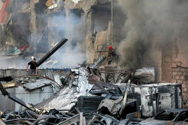 Firefighters attempt to extinguish a fire following an Israeli strike at the Corniche al-Mazraa neighbourhood of Beirut on April 8, 2026. Around 2:00 pm (1100 GMT), a series of Israeli strikes slammed into the Lebanese capital without warning, triggering scenes of panic. Israeli strikes on Lebanon on April 8, the heaviest since the war began in early March, left "dozens dead and hundreds wounded," according to a preliminary toll from the health ministry. (Photo by Ibrahim AMRO / AFP)