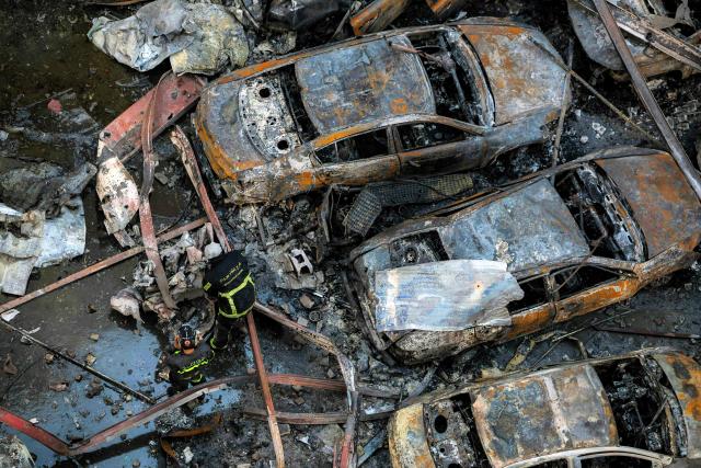 Firefighters attempt to extinguish a fire following an Israeli strike at the Corniche al-Mazraa neighbourhood of Beirut on April 8, 2026. Around 2:00 pm (1100 GMT), a series of Israeli strikes slammed into the Lebanese capital without warning, triggering scenes of panic. Israeli strikes on Lebanon on April 8, the heaviest since the war began in early March, left "dozens dead and hundreds wounded," according to a preliminary toll from the health ministry. (Photo by ibrahim AMRO / AFP)