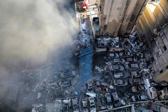 Firefighters attempt to extinguish a fire following an Israeli strike at the Corniche al-Mazraa neighbourhood of Beirut on April 8, 2026. Around 2:00 pm (1100 GMT), a series of Israeli strikes slammed into the Lebanese capital without warning, triggering scenes of panic. Israeli strikes on Lebanon on April 8, the heaviest since the war began in early March, left "dozens dead and hundreds wounded," according to a preliminary toll from the health ministry. (Photo by ibrahim AMRO / AFP)