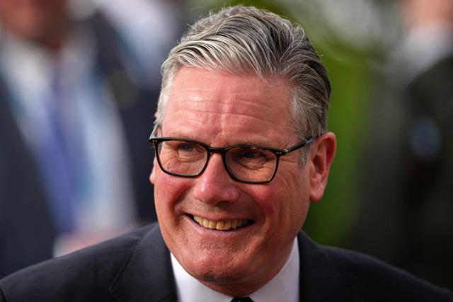 Britain's Prime Minister Keir Starmer smiles during a visit to Taif Airbase, Saudi Arabia, on April 8, 2026. British Prime Minister Keir Starmer arrived on April 9 in Saudi Arabia, on the first stop of a Gulf tour aimed at bolstering the ceasefire in the Middle East war, Downing Street said. (Photo by Alastair Grant / POOL / AFP)
