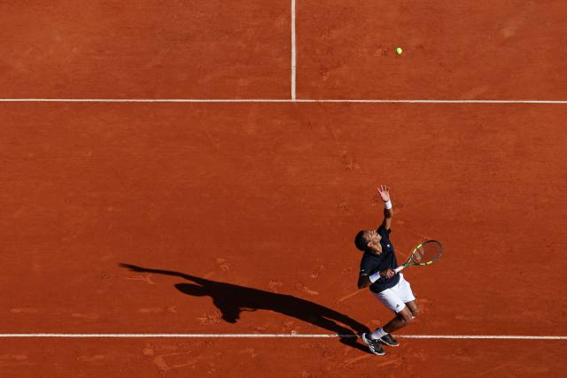 Canada's Felix Auger-Aliassime serves to Croatia's Marin Cilic during the Monte Carlo ATP Masters Series Tournament round of 32 tennis match on Court Rainier III at the Monte-Carlo Country Club in Roquebrune-Cap-Martin, south-eastern France on April 8, 2026. (Photo by Valery HACHE / AFP)