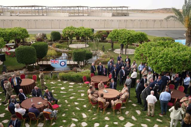 Britain's Prime Minister Keir Starmer sits at a table (R) as he visits Taif Airbase, Saudi Arabia, on April 8, 2026. British Prime Minister Keir Starmer arrived on April 9 in Saudi Arabia, on the first stop of a Gulf tour aimed at bolstering the ceasefire in the Middle East war, Downing Street said. (Photo by Alastair Grant / POOL / AFP)