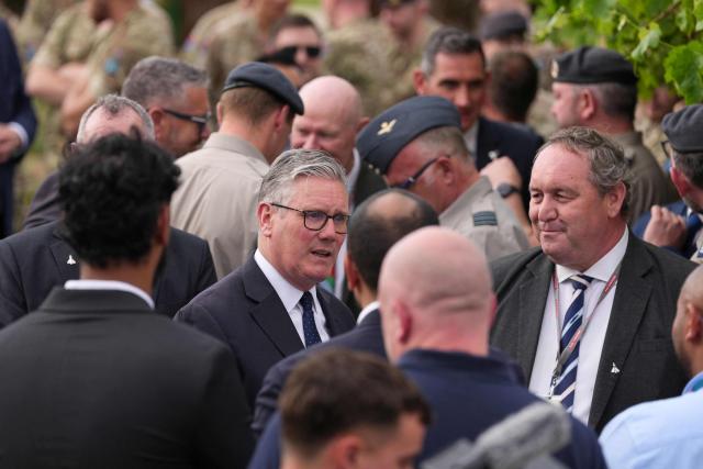 Britain's Prime Minister Keir Starmer (C) meets business leaders during a visit to Taif Airbase, Saudi Arabia, on April 8, 2026. British Prime Minister Keir Starmer arrived on April 9 in Saudi Arabia, on the first stop of a Gulf tour aimed at bolstering the ceasefire in the Middle East war, Downing Street said. (Photo by Alastair Grant / POOL / AFP)