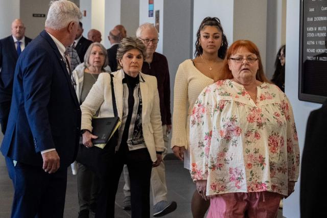 Attorney Gloria Allred (L) arrives with the families of victims at Suffolk County Court for the for expected guilty plea of Rex Heuermann in Long Island, New York, on April 8, 2026. The Gilgo Beach serial killings refer to a series of murders discovered on Long Island in 2010–2011, with Rex Heuermann arrested in 2023 and charged in several of the killings. (Photo by David Dee Delgado / AFP)