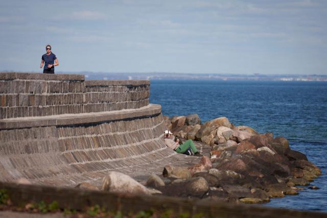People enjoy the spring atmosphere on Strandvejen by Charlottenlund Fort in Copenhagen, Denmark on April 8, 2026. (Photo by Liselotte Sabroe / Ritzau Scanpix / AFP) / Denmark OUT