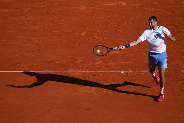 Croatia's Marin Cilic plays a forehand return to Canada's Felix Auger-Aliassime during the Monte Carlo ATP Masters Series Tournament round of 32 tennis match on Court Rainier III at the Monte-Carlo Country Club in Roquebrune-Cap-Martin, south-eastern France on April 8, 2026. (Photo by Valery HACHE / AFP)
