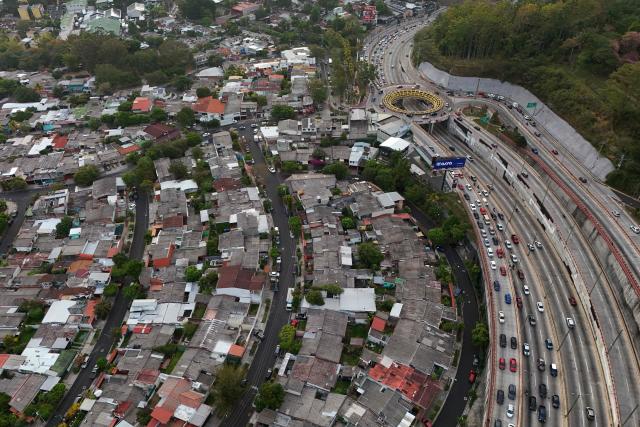 Aerial view of the city of San Salvador during sunrise, on April 8, 2026. (Photo by Marvin RECINOS / AFP)