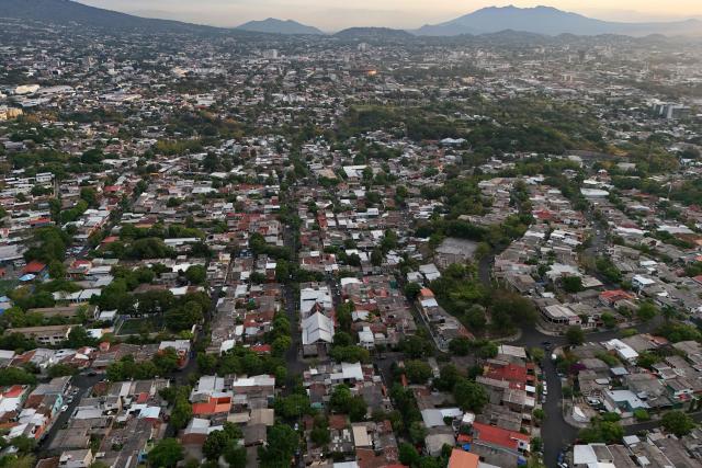 Aerial view of the city of San Salvador during sunrise, on April 8, 2026. (Photo by Marvin RECINOS / AFP)