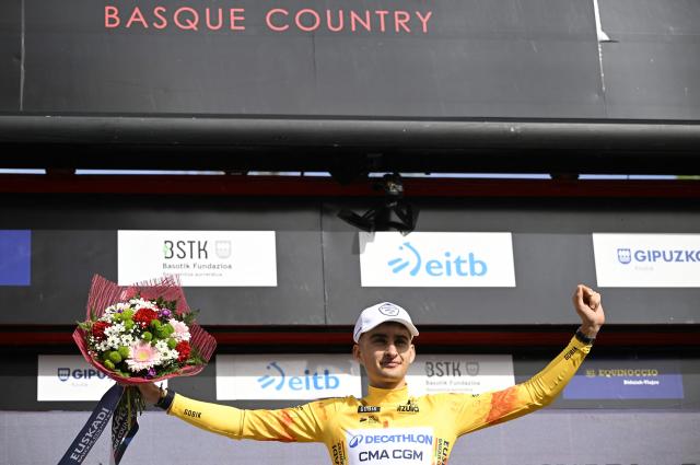 Overall ranking leader Team Decathlon CMA CGM's French rider Paul Seixas celebrates on the podium after the third stage of the Basque Country's Itzulia cycling tour, a 152.8 km race starting and finishing in Basauri, on April 8, 2026. (Photo by ANDER GILLENEA / AFP)