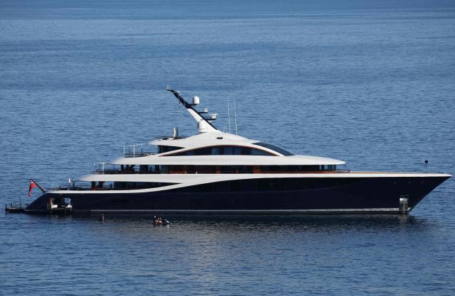 This photograph shows the 79.9-metre Feadship superyacht 'Faith' owned by Canadian businessman Lawrence Stroll, majority shareholder of British luxury carmaker Aston Martin, off the coast of Monaco on April 8, 2026. (Photo by Valery HACHE / AFP)