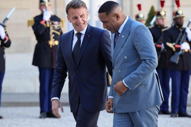President of Botswana Duma Boko (R) is welcomed by French President Emmanuel Macron (2ndR) prior to their meeting at the Elysee Palace in Paris on April 8, 2026. (Photo by Ludovic MARIN / AFP)