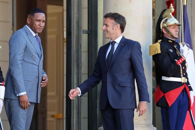 President of Botswana Duma Boko (L) is welcomed by French President Emmanuel Macron (2ndR) prior to their meeting at the Elysee Palace in Paris on April 8, 2026. (Photo by Ludovic MARIN / AFP)