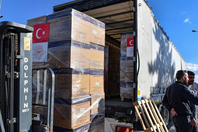 Medical supplies prepared by the Turkish Health Ministry are loaded onto trucks before departing for Iran in Van, north-eastern Turkey, on April 8, 2026. Three trucks loaded with humanitarian aid are scheduled to enter Iran on April 8, 2026 from Turkey, announced Turkish Health Minister Kemal Memisoglu. (Photo by Ali IHSAN OZTURK / AFP)