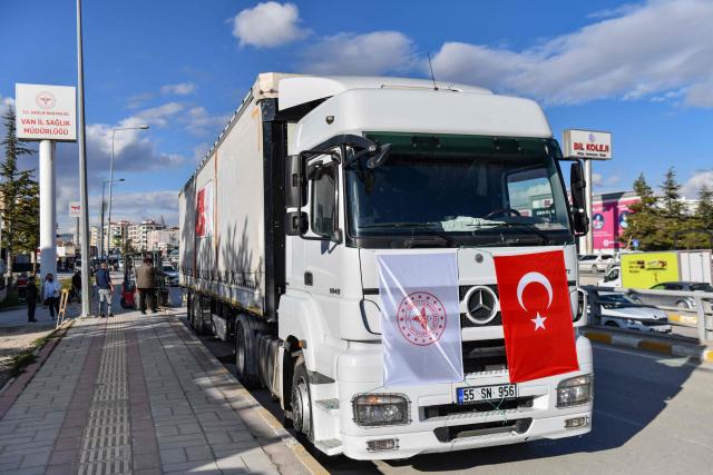 A truck bearing Turkish and Health Ministry flags and loaded with medical supplies prepared by the Turkish Health Ministry is parked before departing for Iran in Van, north-eastern Turkey, on April 8, 2026. Three trucks loaded with humanitarian aid are scheduled to enter Iran on April 8, 2026 from Turkey, announced Turkish Health Minister Kemal Memisoglu. (Photo by Ali IHSAN OZTURK / AFP)